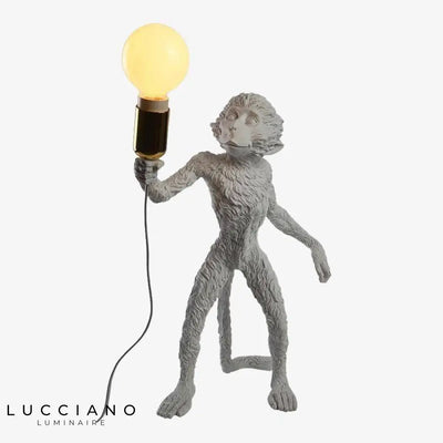 Lampe à poser singe en résine et bakélite